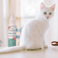 Wondercide Flea & Tick Spray with a white cat